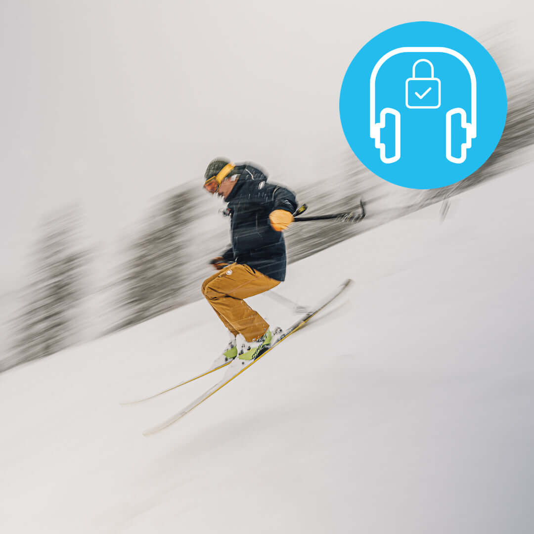 image of a skier using secure fit headphones on a run located on the h2o audio waterproof headphones homepage
