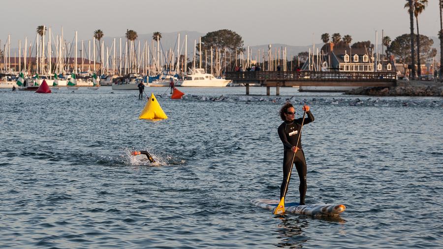 A swimmer approaches the finish of the Ironman 70.3 Oceanside swim course. 