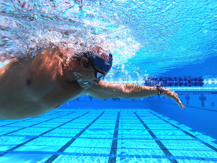 a man swimming in a pool